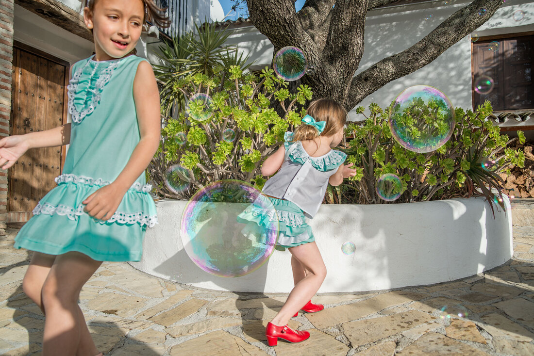 Catching bubbles in bespoke cotton and lace teal daywear