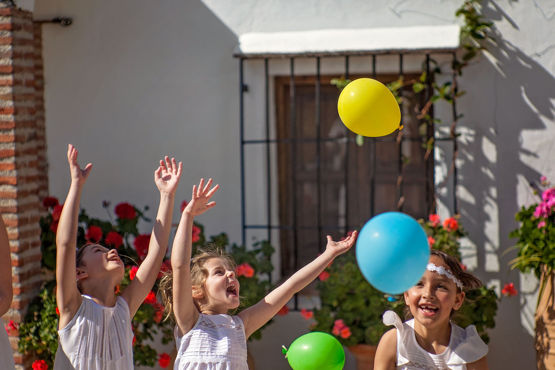 Catching balloons in the garden